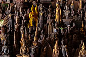 Luang Prabang, Laos - The Pak Ou Caves, the lower cave called Tham Ting. The caves, a Buddhist pilgrimage site, are a repository of old Buddha statues. 